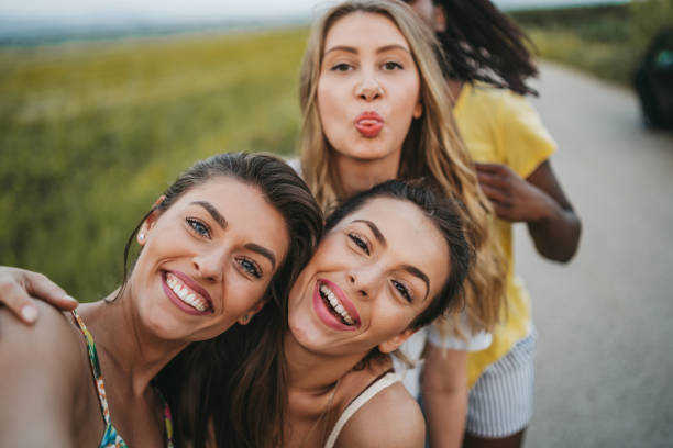 istock Cheerful girlfriends having fun in nature 1222916022