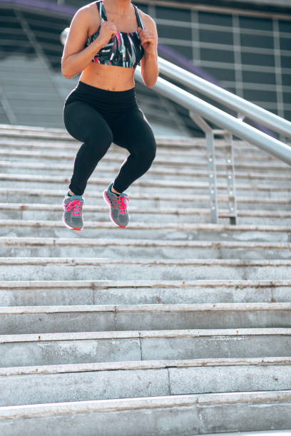 istock fitness woman jump on the steps 1222917986