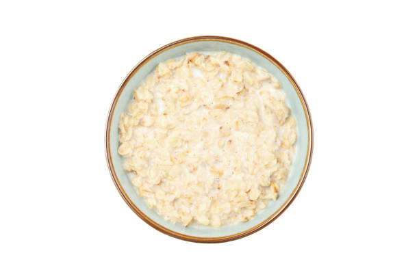 istock Bowl with cooked oatmeal isolated on white background 1222918396