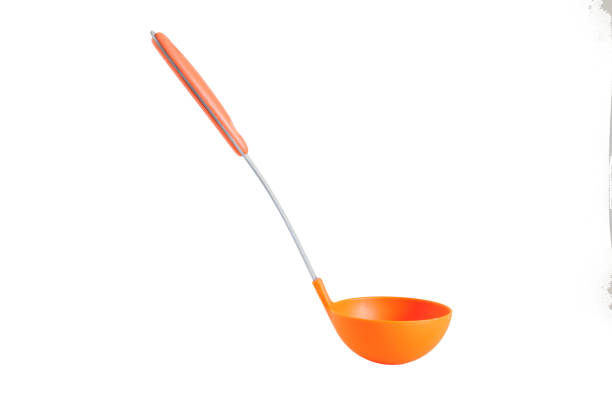 Orange ladle on white background Orange ladle on white background serving utensil stock pictures, royalty-free photos & images