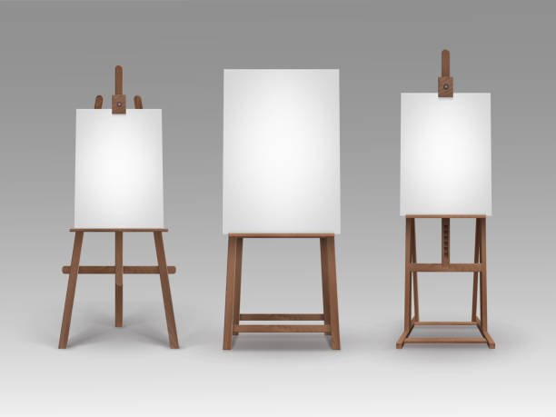 istock Set of Brown Wooden Easels with Mock Up Canvases 1222923890