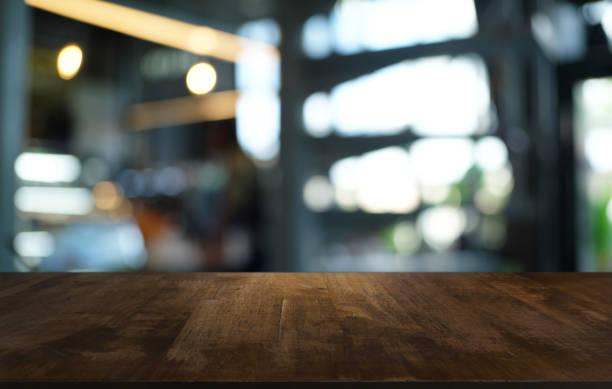 istock Wood Table Top in Blur Background room interior with empty copy space. 1222924058