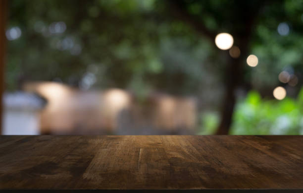 istock Wood Table Top in Blur Background room interior with empty copy space. 1222924105
