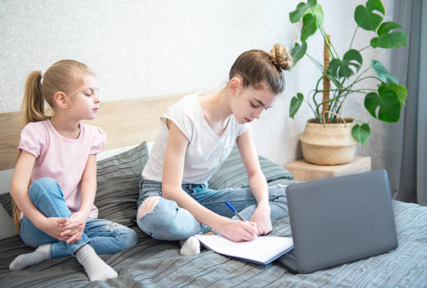 istock Schoolgirls  studing at home 1222927473