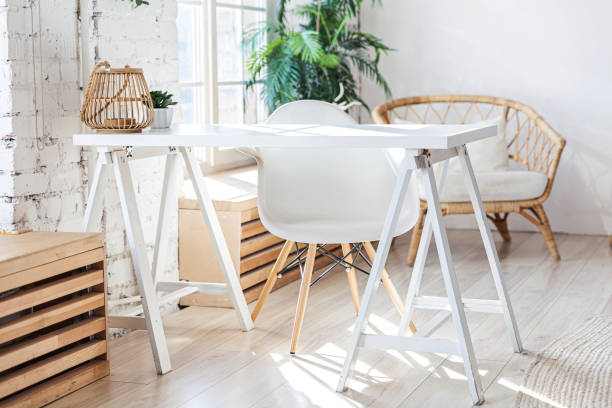 istock Stylish loft modern home office interior. Spacious design apartment with light walls large windows and writing desk. Clean modern decoration with elegant furniture in minimalist Scandinavian style 1222928904