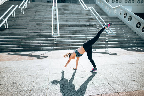 istock fitness woman doing exercize in the city 1222929105