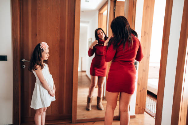 istock get dressing in front of the mirror 1222931031