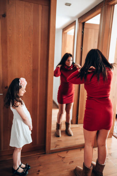 istock get dressing in front of the mirror 1222931150