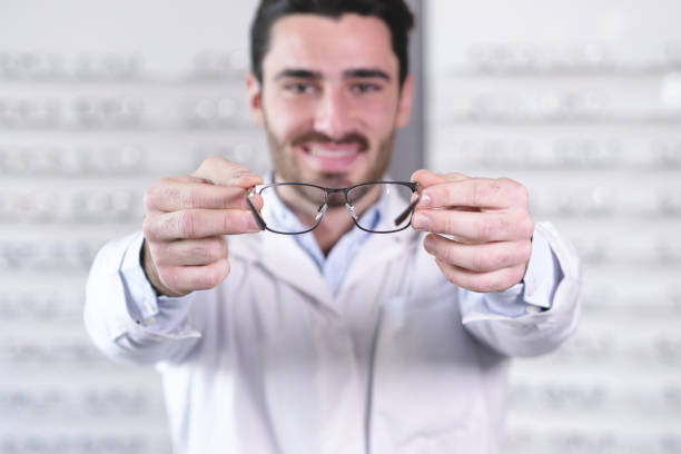 istock An ophthalmologist doing a visual examination for a customer at an optical center. 1222931751