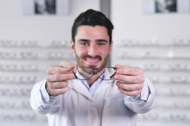 istock An ophthalmologist doing a visual examination for a customer at an optical center. 1222931801