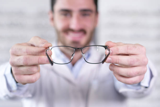 istock An ophthalmologist doing a visual examination for a customer at an optical center. 1222931831