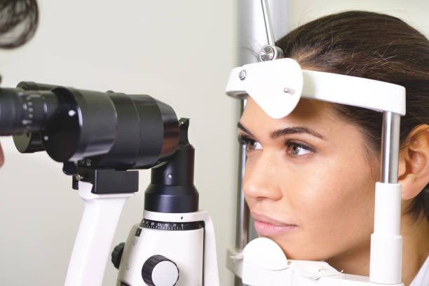istock An ophthalmologist doing a visual examination for a customer at an optical center. 1222931873