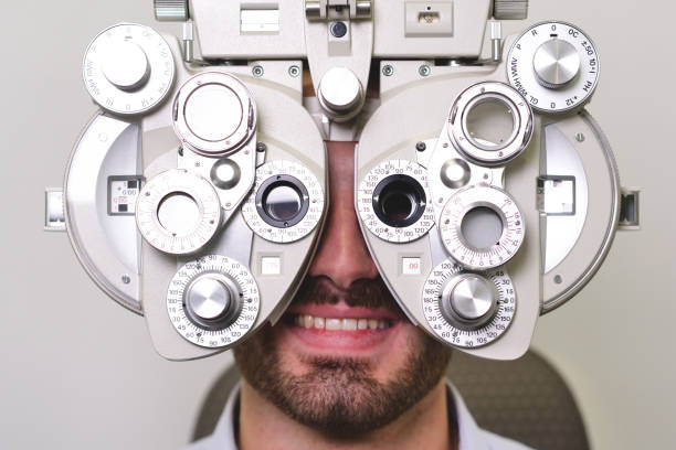 istock An ophthalmologist doing a visual examination for a customer at an optical center. 1222931902