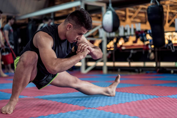 istock Young handsome kick boxer training hard and preparing for fight 1222931938