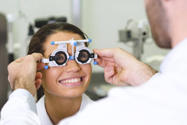 istock An ophthalmologist doing a visual examination for a customer at an optical center. 1222932588