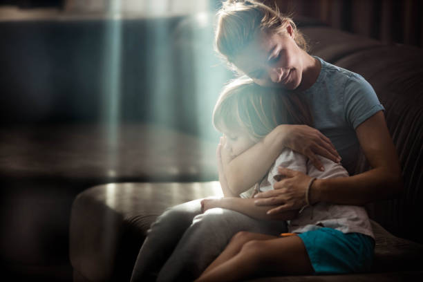 istock Affectionate single mother and son embracing at home. 1222935284