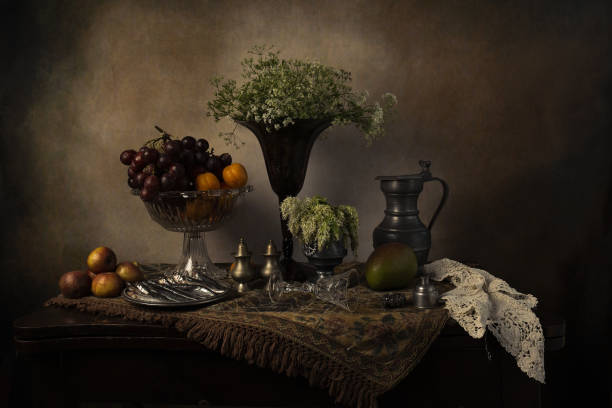 istock Objects on the table is an ancient vase of flowers, fruit, wine glass 1222935414