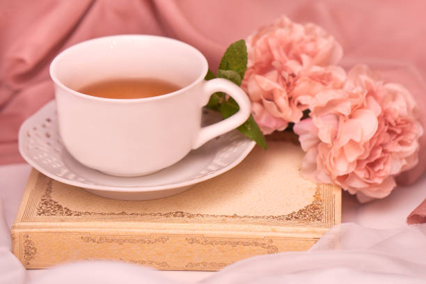 istock Cup of hot tea with mint and peonies 1222935998