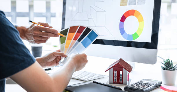 istock Team design of young Interior graphic designer working house project sketching on graphic tablet and color swatch working at modern office, creative inspiration and imagine 1222937073