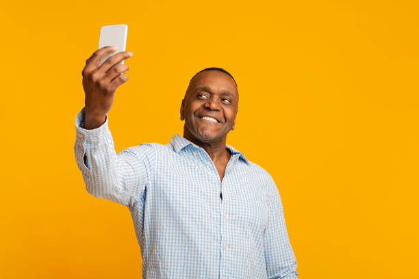 istock Handsome mature black man making selfie and smiling 1222937583