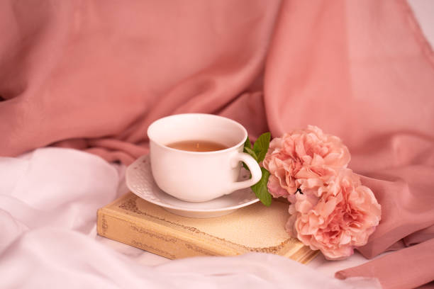 istock Cup of hot tea with mint and peonies 1222937655
