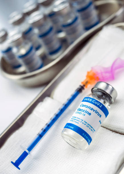 istock Coronavirus covid-19 experimental vaccine in a laboratory, conceptual image 1222937694