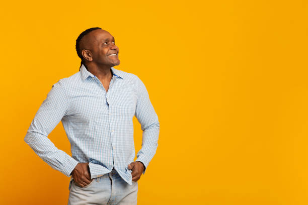 istock Smiling mature afro american man looking at free space 1222937842