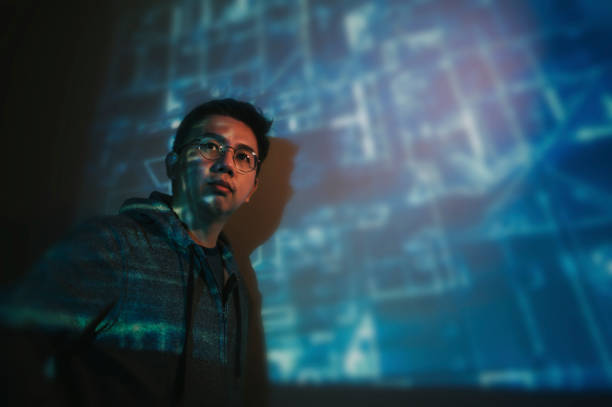 istock portrait of asian chinese man with projector reflect image on wall 1222940668