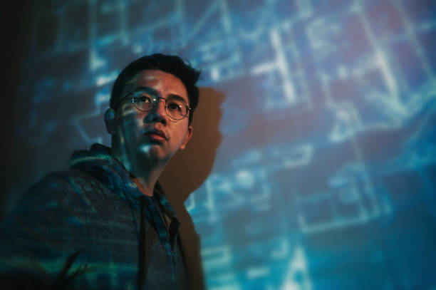 portrait of asian with projector reflect image on wall