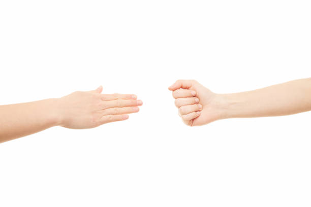 istock Two women arms, rock paper scissors, hand gesture 1222940971