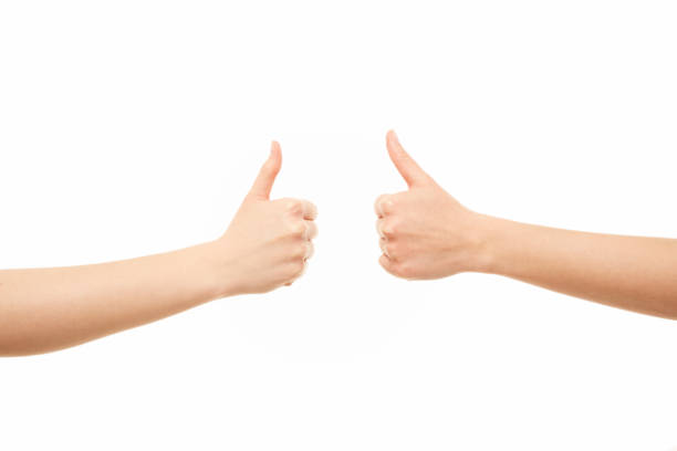 istock Two women arms thumbs up 1222941030