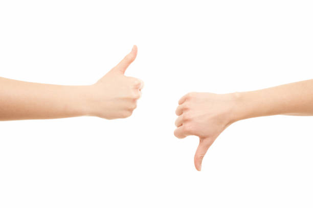 istock Two women arms thumbs up, thumbs down 1222941043