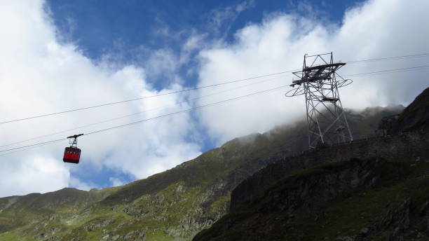 istock Cable Cart Sliding Down a Lush Green Mountain 1222944390