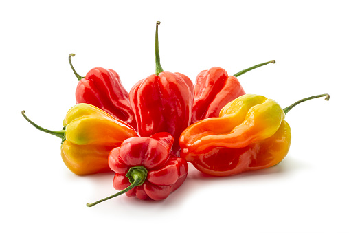 Fresh Scotch bonnet peppers on white background
