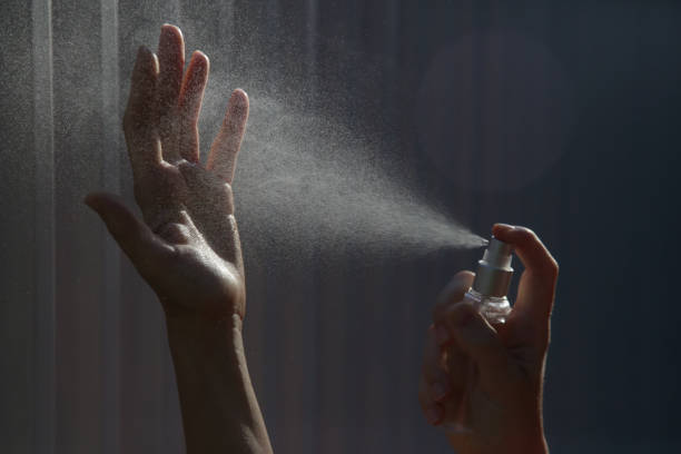 istock Hands spray. Antibacterial spray for hands. Woman spray hands sanitizer for preventive coronavirus spread. Epidemic prevention, disinfection, skin care concept. 1222945613