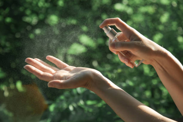 istock Hands spray. Antibacterial spray for hands. Woman spray hands sanitizer for preventive coronavirus spread. Epidemic prevention, disinfection, skin care concept. 1222945675