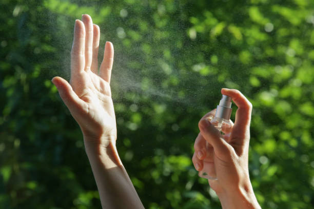 istock Hands spray. Antibacterial spray for hands. Woman spray hands sanitizer for preventive coronavirus spread. Epidemic prevention, disinfection, skin care concept. 1222945819