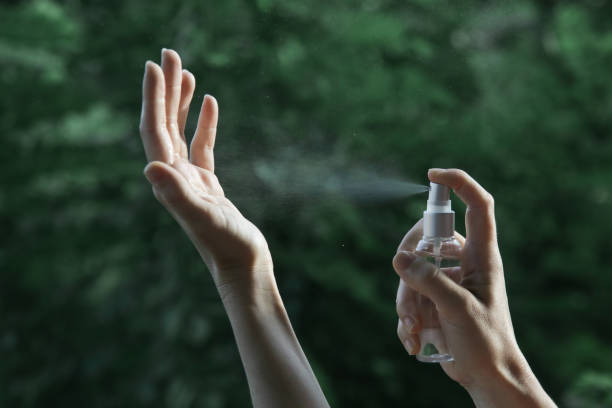 istock Hands spray. Antibacterial spray for hands. Woman spray hands sanitizer for preventive coronavirus spread. Epidemic prevention, disinfection, skin care concept. 1222945832