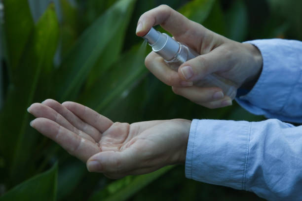 istock Hands spray. Antibacterial spray for hands. Woman spray hands sanitizer for preventive coronavirus spread. Epidemic prevention, disinfection, skin care concept. 1222945909