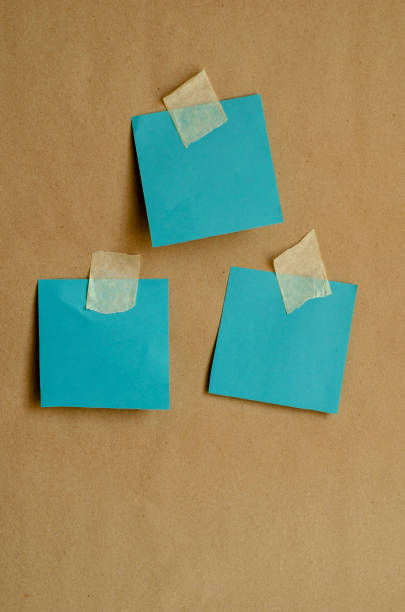istock Turquoise blank planks with duct tape on a plain wall. 1222950285