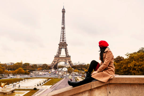 istock asian traveler sitting with Eiffel tower view in Paris 1222950317