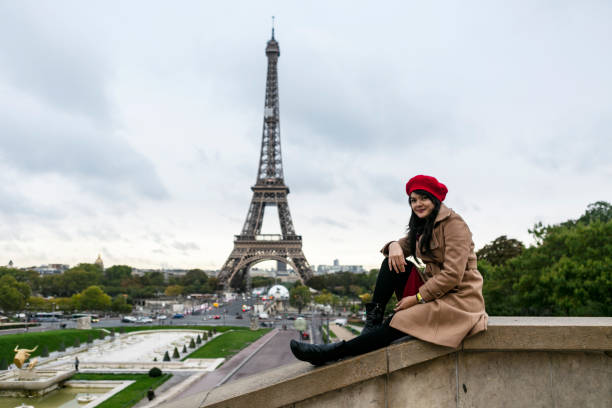 istock asian traveler sitting with Eiffel tower view in Paris 1222950318