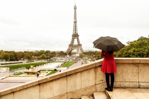 istock asian traveler with umbrella in Paris 1222950356