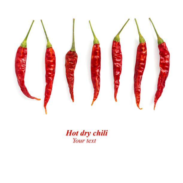 Dry hot chili pepper isolated on a white background. Creative layout. Top view, flat lay, copy space, border Dry hot chili pepper isolated on a white background. Creative layout. Top view, flat lay, copy space, border. healthy eating red above studio shot stock pictures, royalty-free photos & images