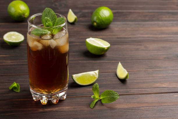 istock Cold summer tea with ice and mint. On table lime and mint leaves 1222950638