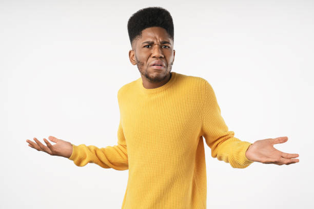 istock Angry and mad african man standing over white background 1222953585