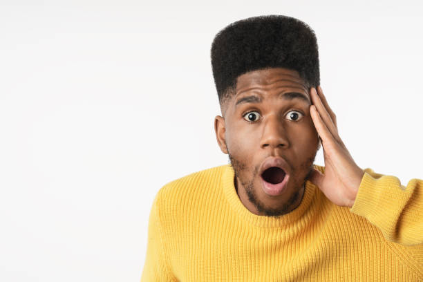 istock Young man with excited face over isolated background shocked with surprise expression 1222953613