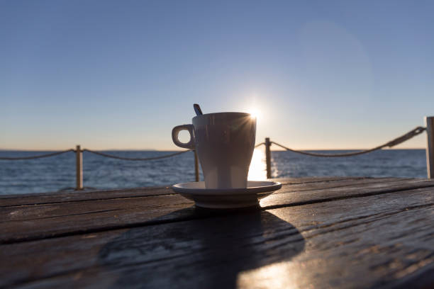istock coffee at sunset on a terrace by the sea 1222954736