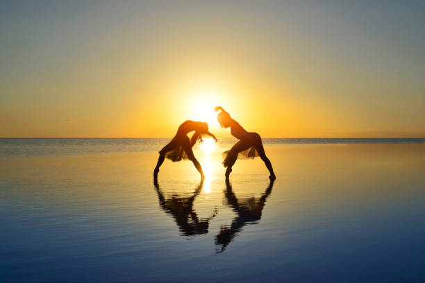 Ballerinas dancing together at sunset on the lake - Salt lake in Turkey