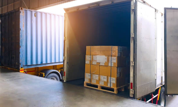 istock Interior of warehouse dock with Truck docking load shipment goods. 1222956643